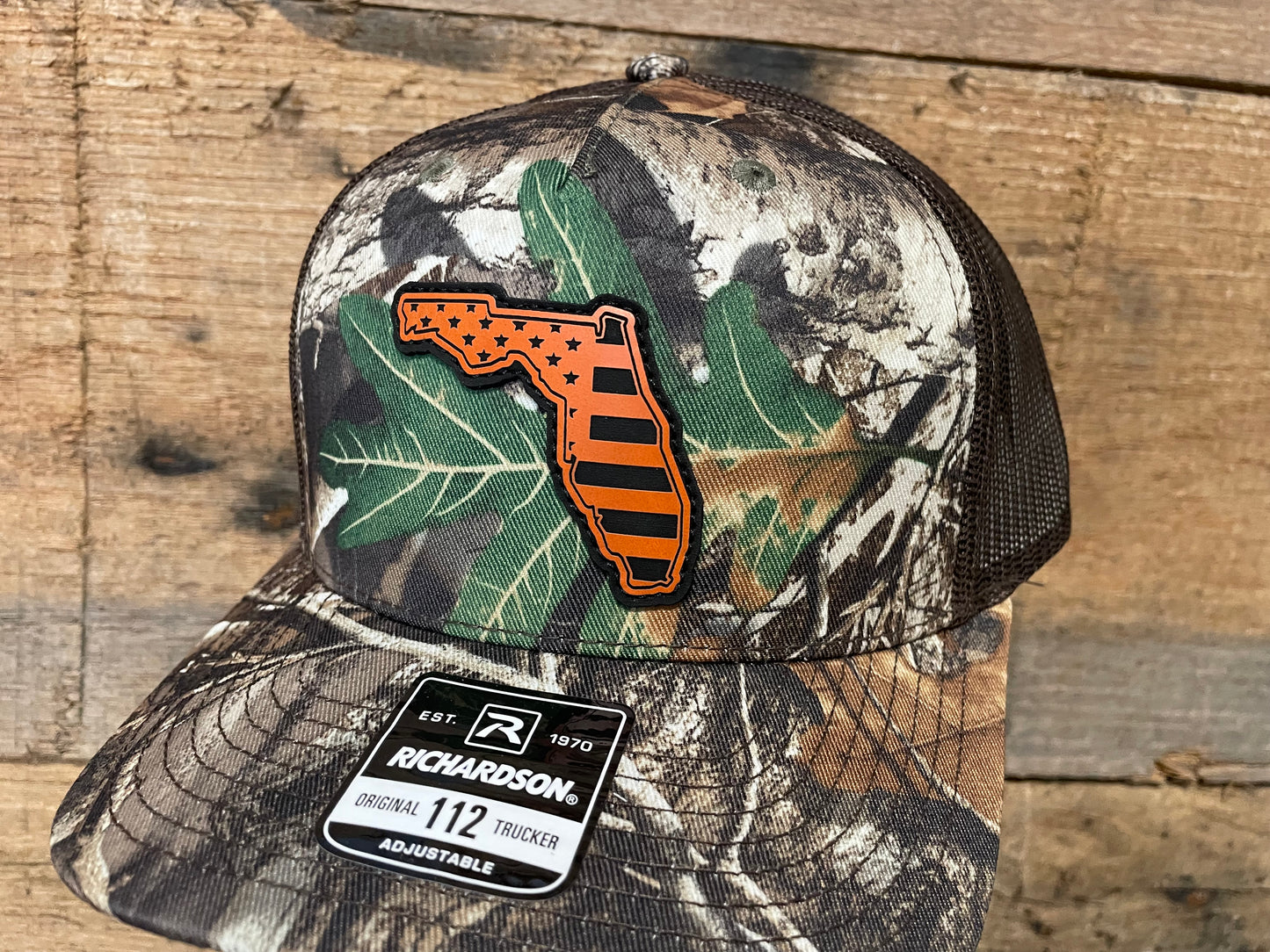 Florida State Outline w/ US Flag Engraved - Orange - Realtree Edge