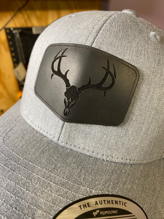 Deer Skull Black Leather on Yupoong 6606 Trucker